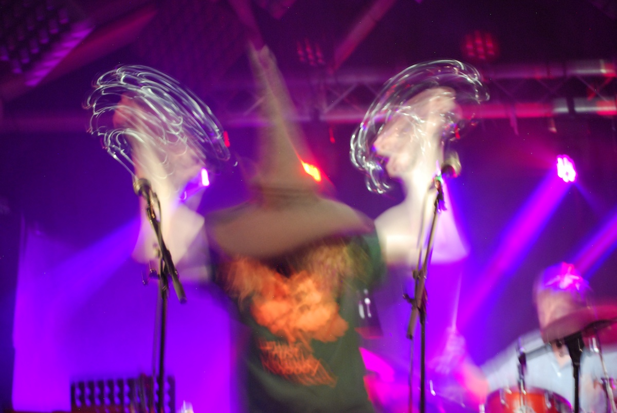 a blurred photo of Flickers from the Fen on stage