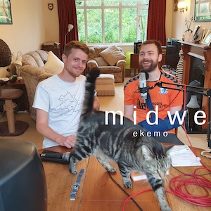 Monty and Adam with a cat in the foreground