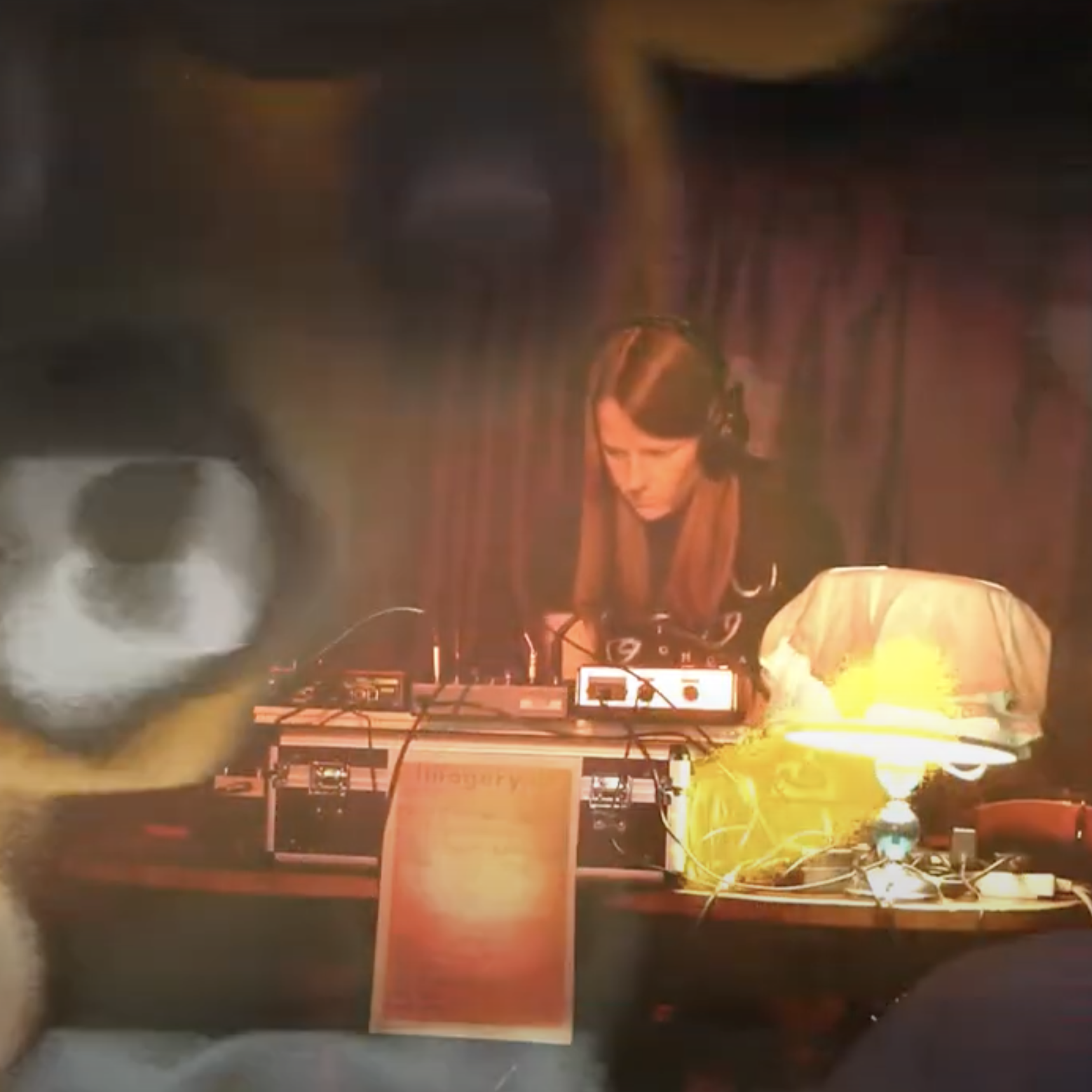 an overlayed image combining Cascade's live set with motion blur footage filmed from a bus