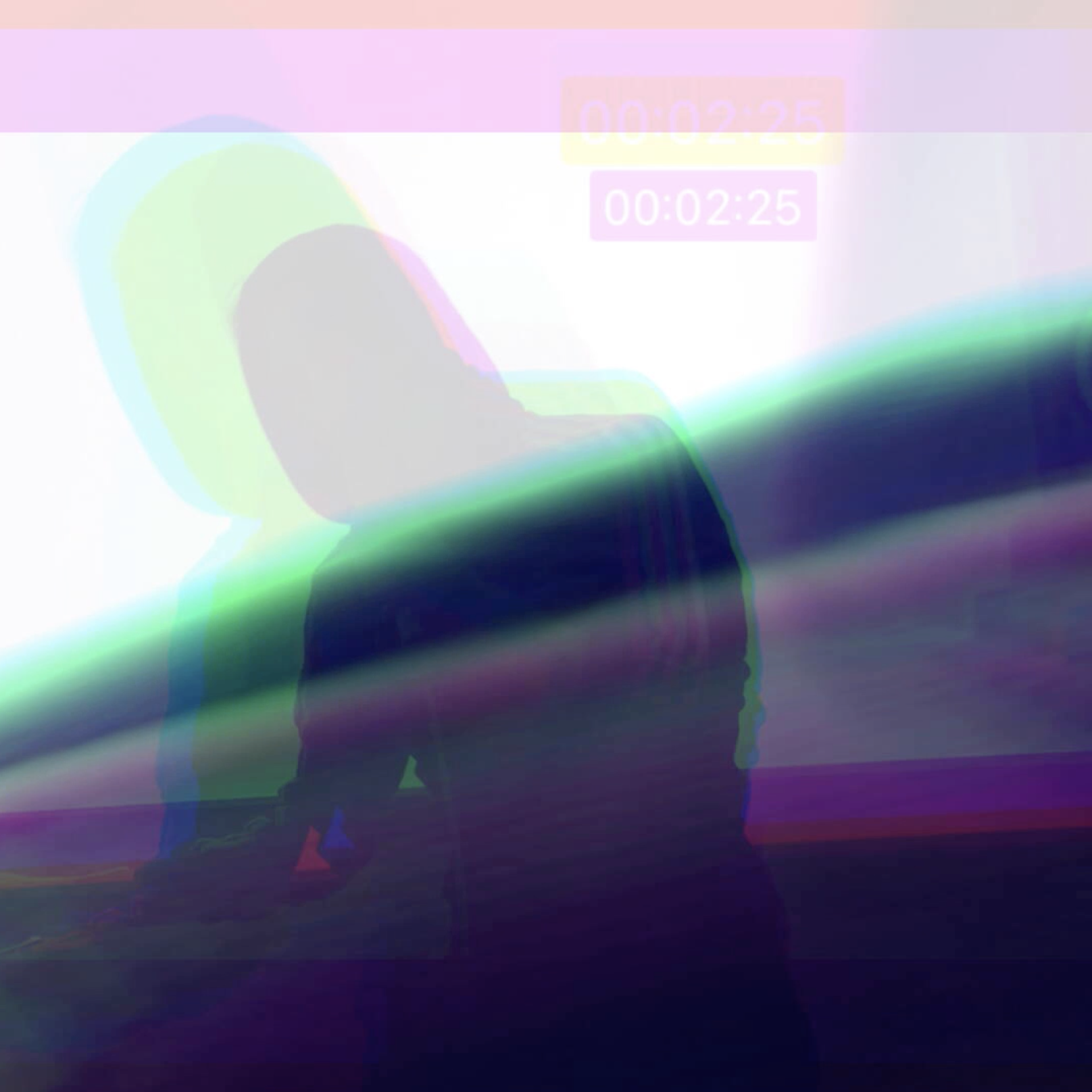 a silhouetted figure viewed through a multicoloured iPhone video interface